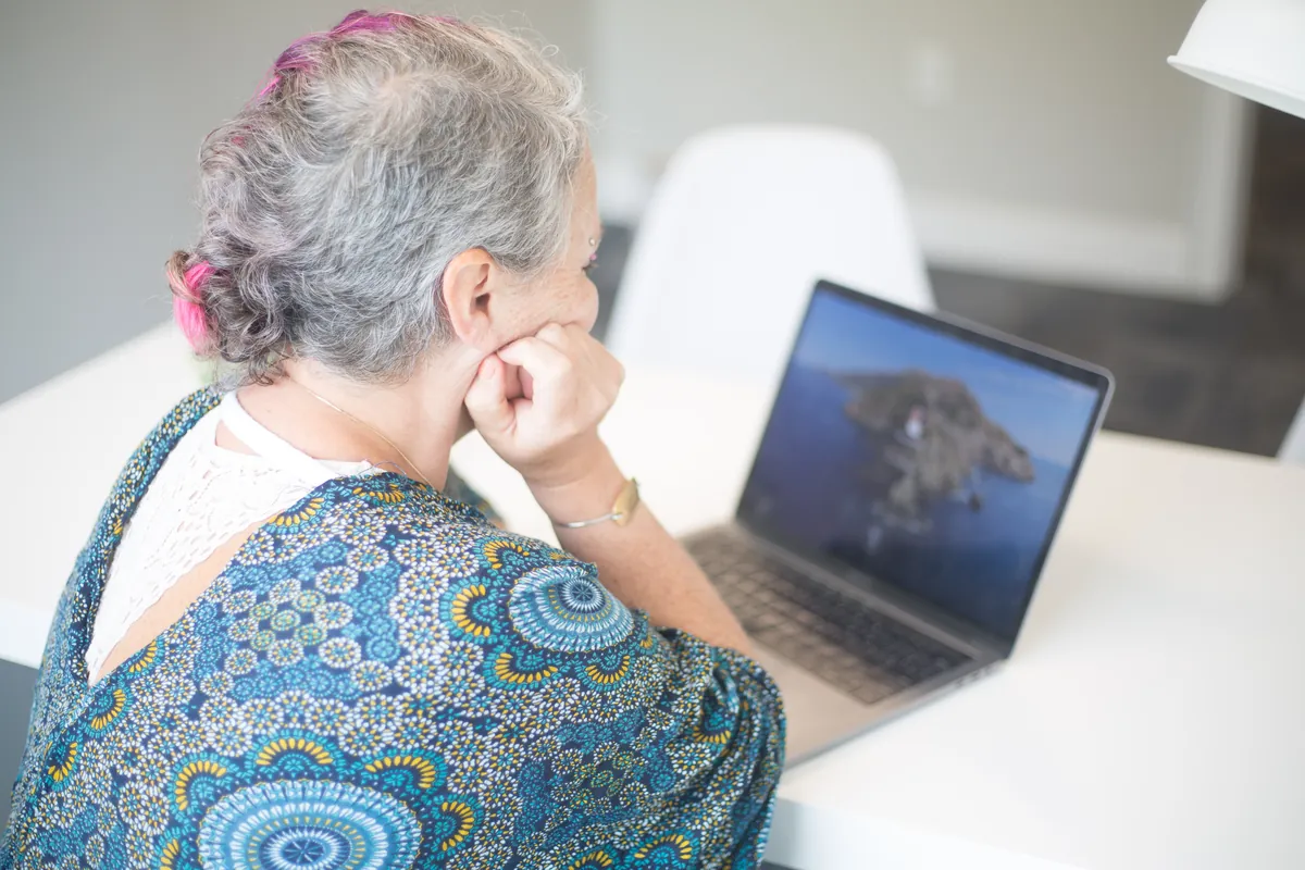 Older woman looking at a laptop, a private setup that works for a video visit in Boynton Beach